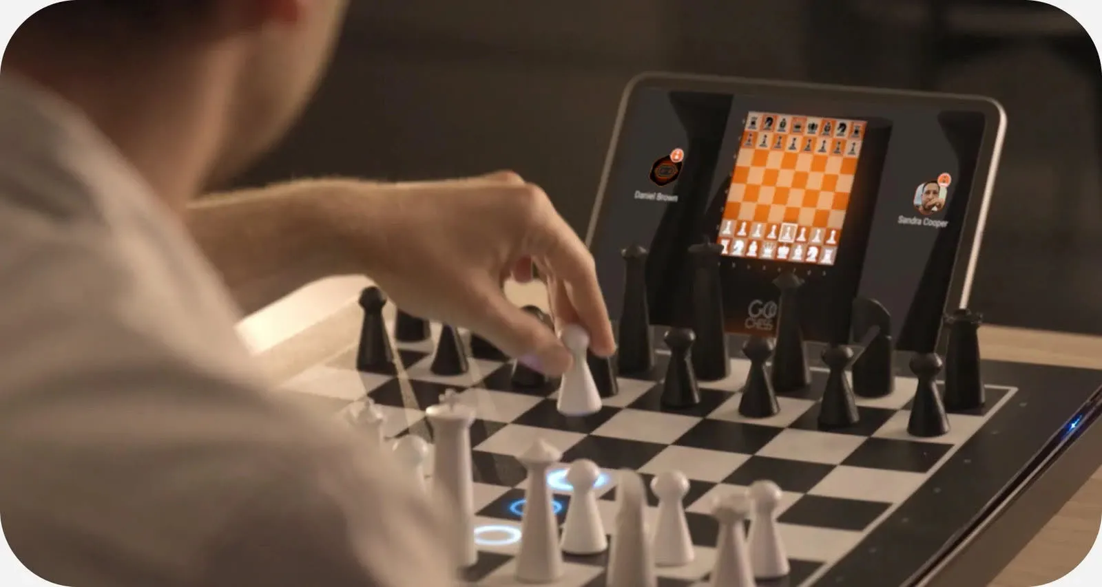 A player moving a piece on GoChess with the app open on a tablet